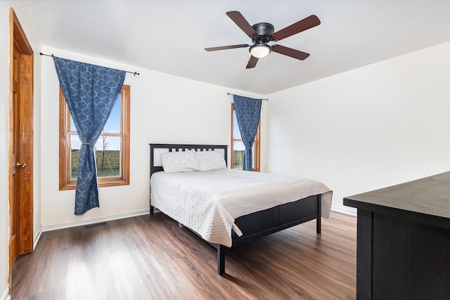 bedroom with ceiling fan and wood-type flooring