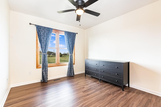 bedroom with dark wood-type flooring and ceiling fan