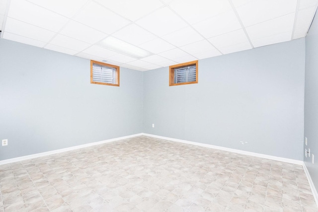 basement featuring a paneled ceiling