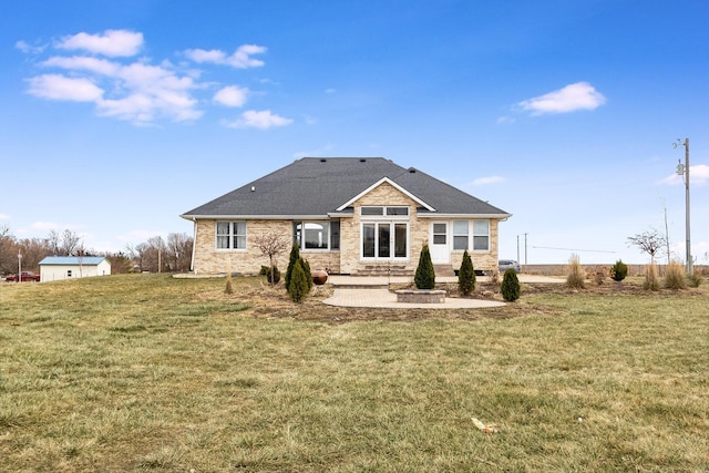 rear view of property with a patio and a lawn