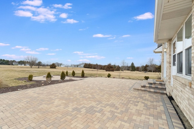 view of patio with a rural view