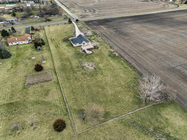 birds eye view of property with a rural view