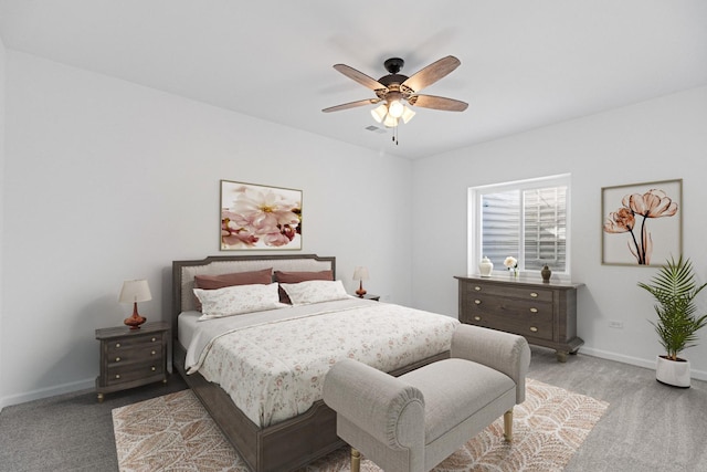 bedroom featuring ceiling fan and light carpet