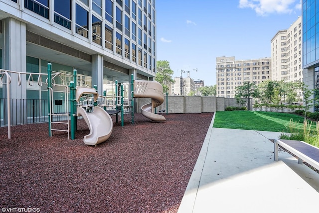 view of jungle gym featuring a lawn