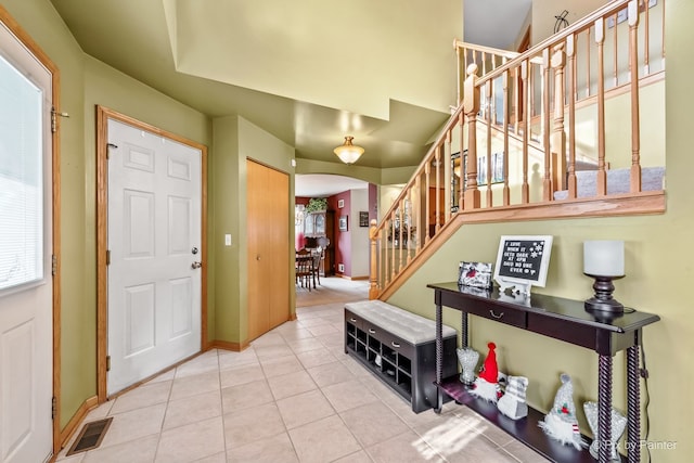 entrance foyer featuring light tile patterned floors