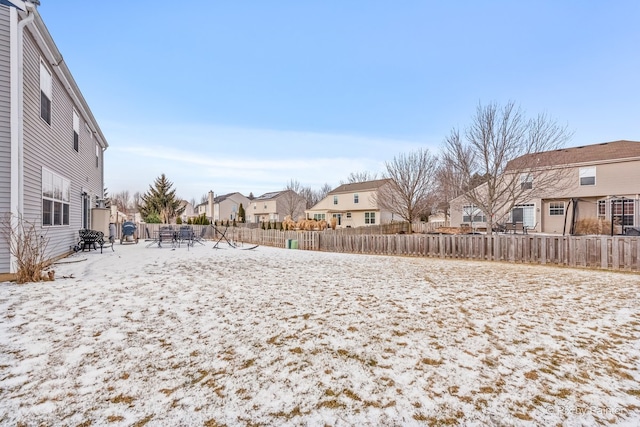 view of yard layered in snow