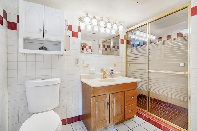 6159 S Karlov Ave, Chicago, IL 60629 - bathroom featuring a shower with shower door, toilet, tile walls, tile patterned floors, and vanity