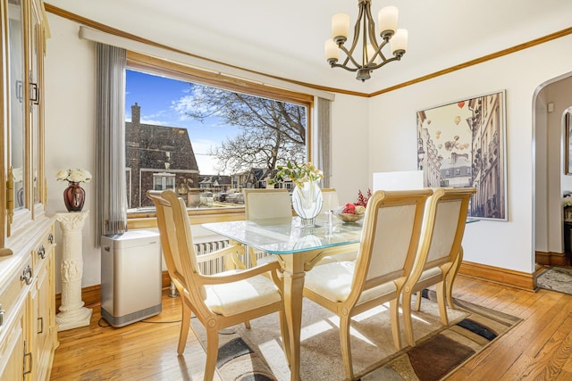 6159 S Karlov Ave, Chicago, IL 60629 - dining room with crown molding, plenty of natural light, light hardwood / wood-style flooring, and a notable chandelier