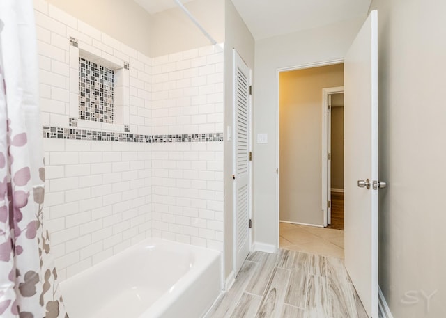 bathroom featuring shower / bath combination with curtain