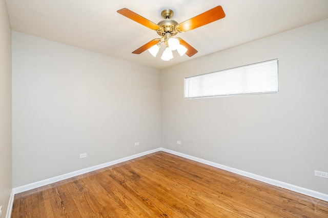 unfurnished room featuring hardwood / wood-style floors and ceiling fan