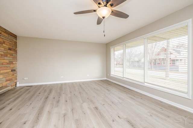 unfurnished room with ceiling fan and light hardwood / wood-style flooring