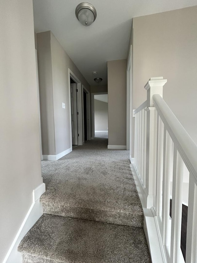 corridor with carpet floors