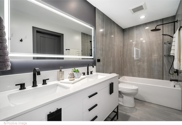 full bathroom featuring washtub / shower combination, vanity, toilet, and tasteful backsplash