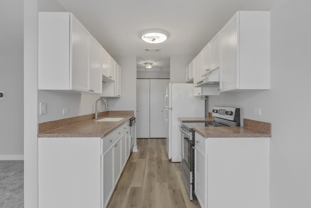 kitchen featuring stainless steel appliances, white cabinetry, sink, and light hardwood / wood-style floors