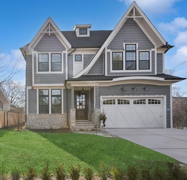 craftsman inspired home featuring a garage and a front yard