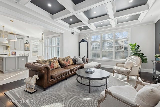 living room featuring beamed ceiling, plenty of natural light, coffered ceiling, and light hardwood / wood-style floors