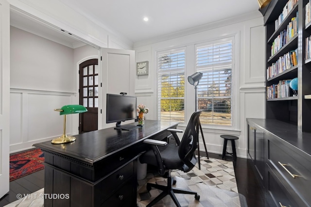 office with ornamental molding and light hardwood / wood-style flooring