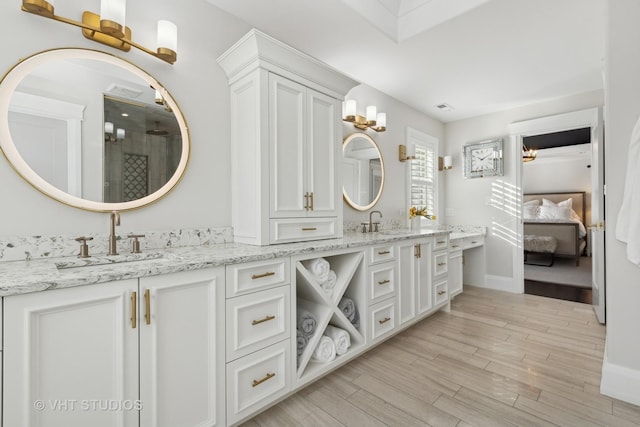 bathroom featuring wood-type flooring and vanity