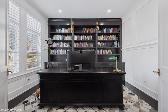 office with built in features and light wood-type flooring