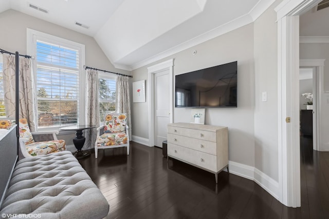 living room with lofted ceiling, crown molding, and dark hardwood / wood-style floors