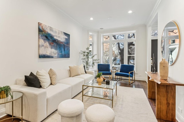 living room with crown molding and hardwood / wood-style floors