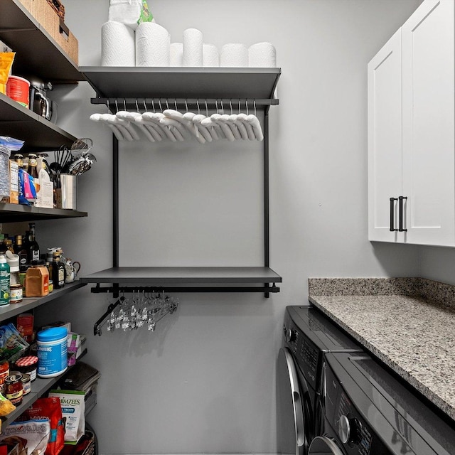 interior space featuring cabinets and washer and dryer