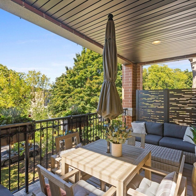 view of patio with a balcony and an outdoor hangout area