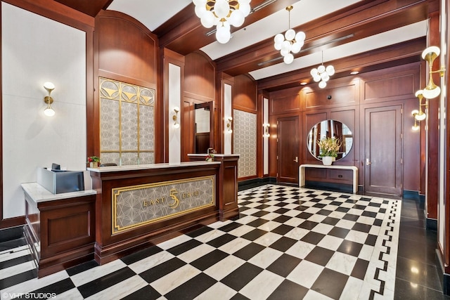 reception featuring a chandelier and beamed ceiling