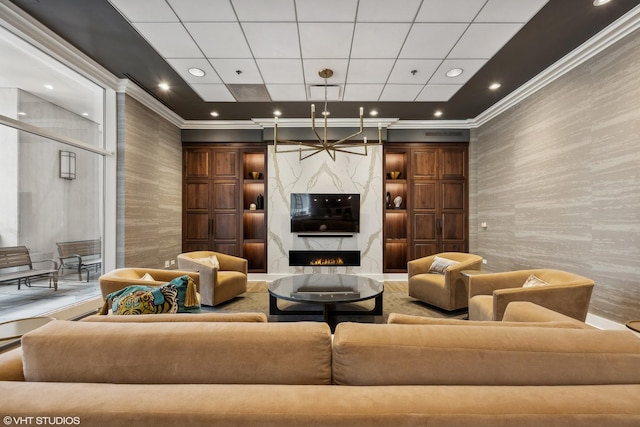 building lobby featuring wallpapered walls, crown molding, and recessed lighting