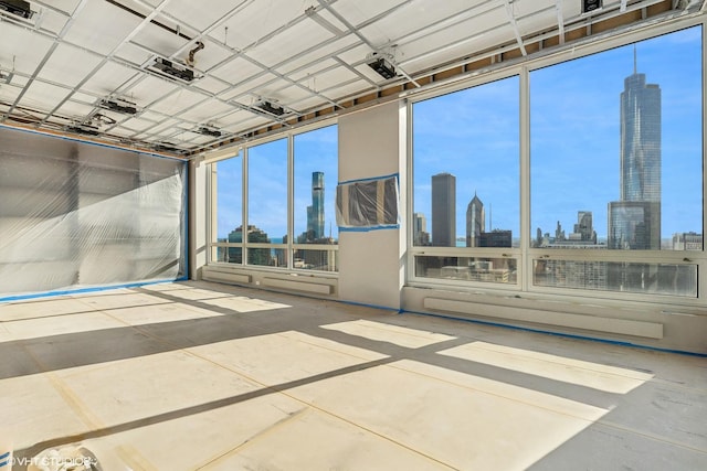 unfurnished sunroom with a skyline view