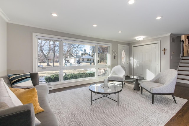 living room featuring crown molding, a wealth of natural light, and dark hardwood / wood-style floors