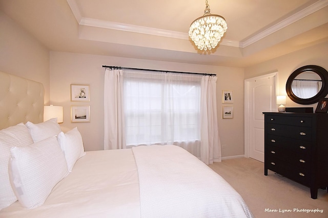 carpeted bedroom with crown molding, a chandelier, and a raised ceiling