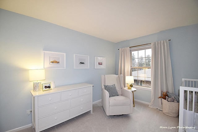 living area featuring light colored carpet