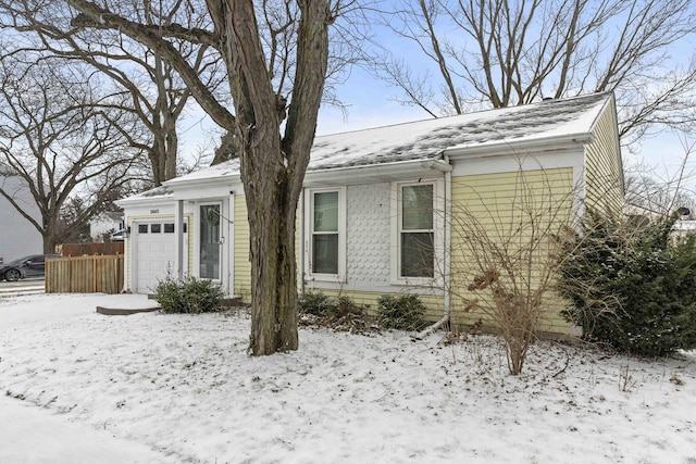 single story home with a garage