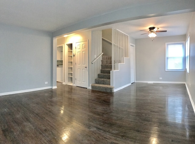 empty room featuring ceiling fan and dark hardwood / wood-style flooring