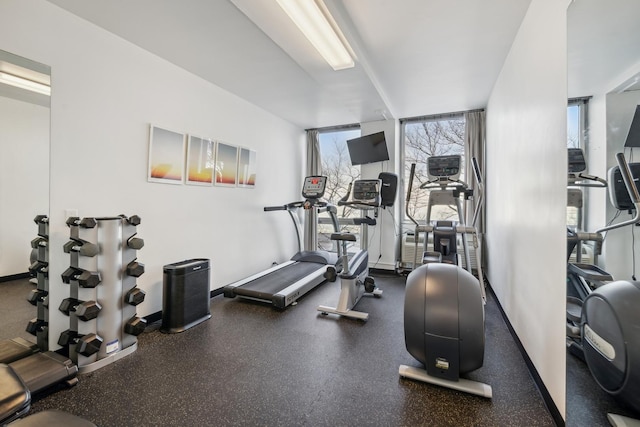 workout area with a wall of windows