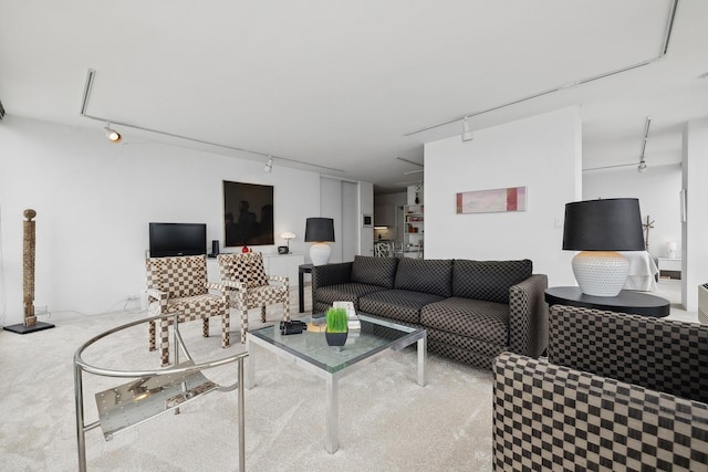 living room featuring track lighting and carpet floors