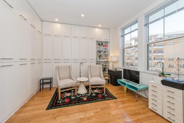 sitting room with light hardwood / wood-style floors