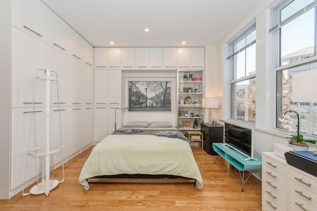 bedroom with light hardwood / wood-style floors