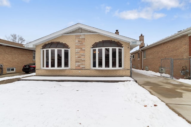 view of snow covered house