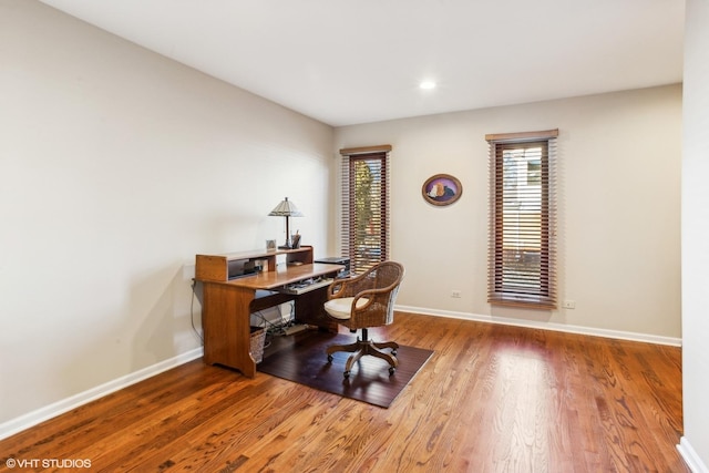 office area with hardwood / wood-style floors