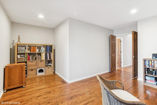 home office with hardwood / wood-style flooring