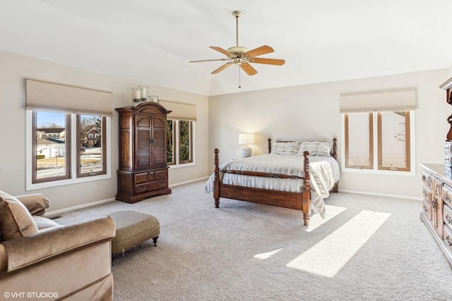 bedroom featuring light carpet and ceiling fan