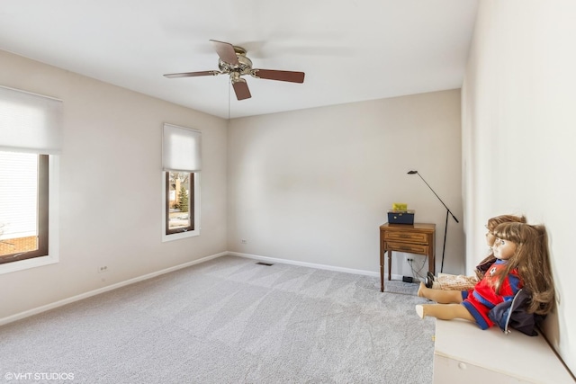 carpeted empty room with ceiling fan