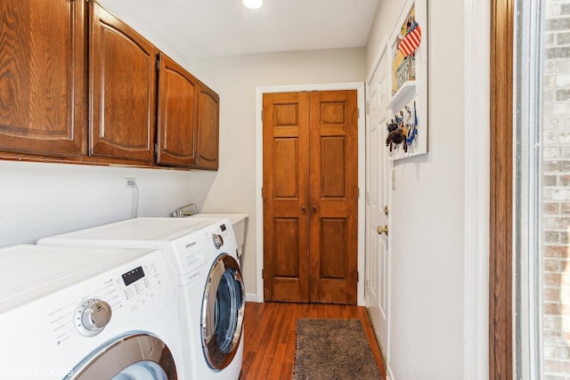 laundry area with sink, cabinets, dark wood-type flooring, and washer and dryer