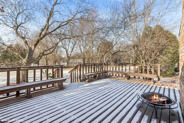 wooden deck with an outdoor fire pit