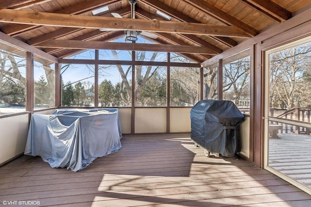 sunroom / solarium with vaulted ceiling with beams and wood ceiling