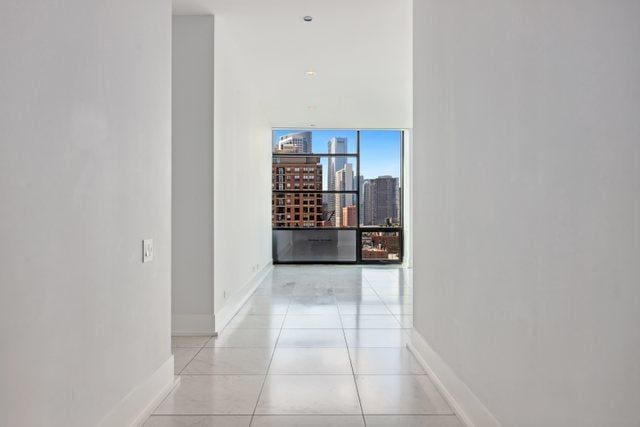 hallway with light tile patterned floors