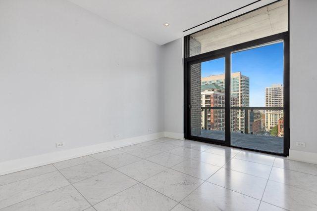 empty room featuring expansive windows