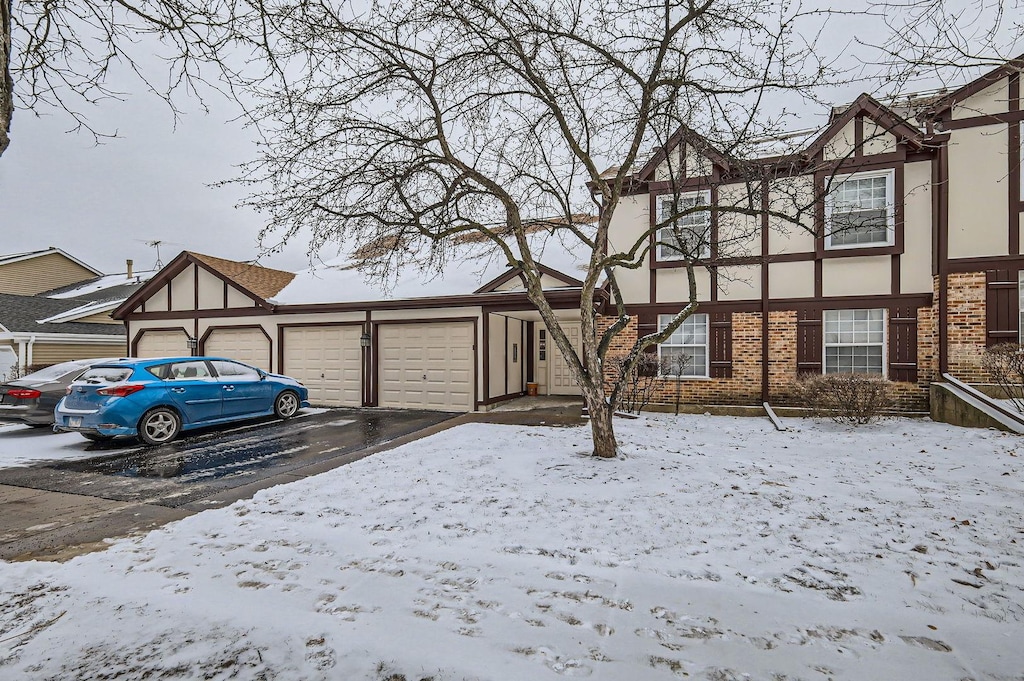 tudor home featuring a garage